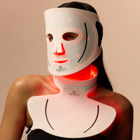 Full-coverage LED therapy on woman’s face and neck